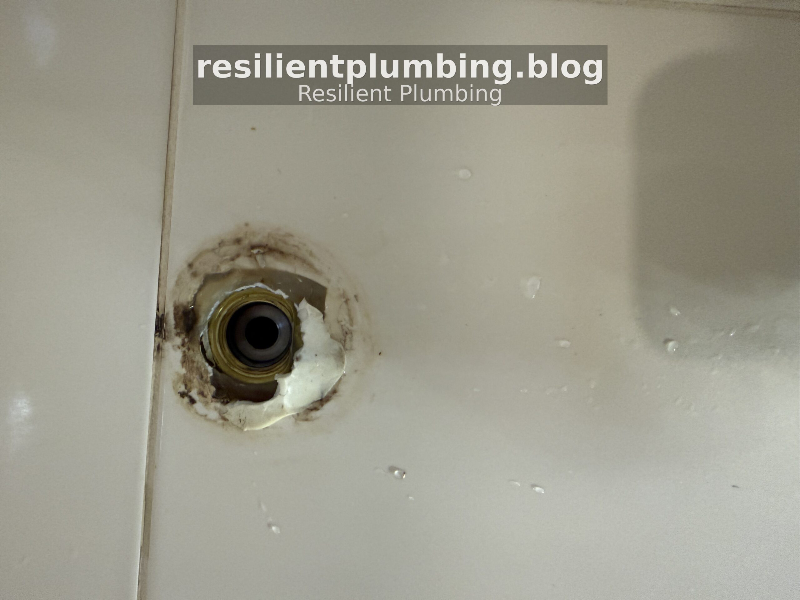 Damaged tap seater housing exposed after shower fitting removed showing deteriorated sealant and water staining