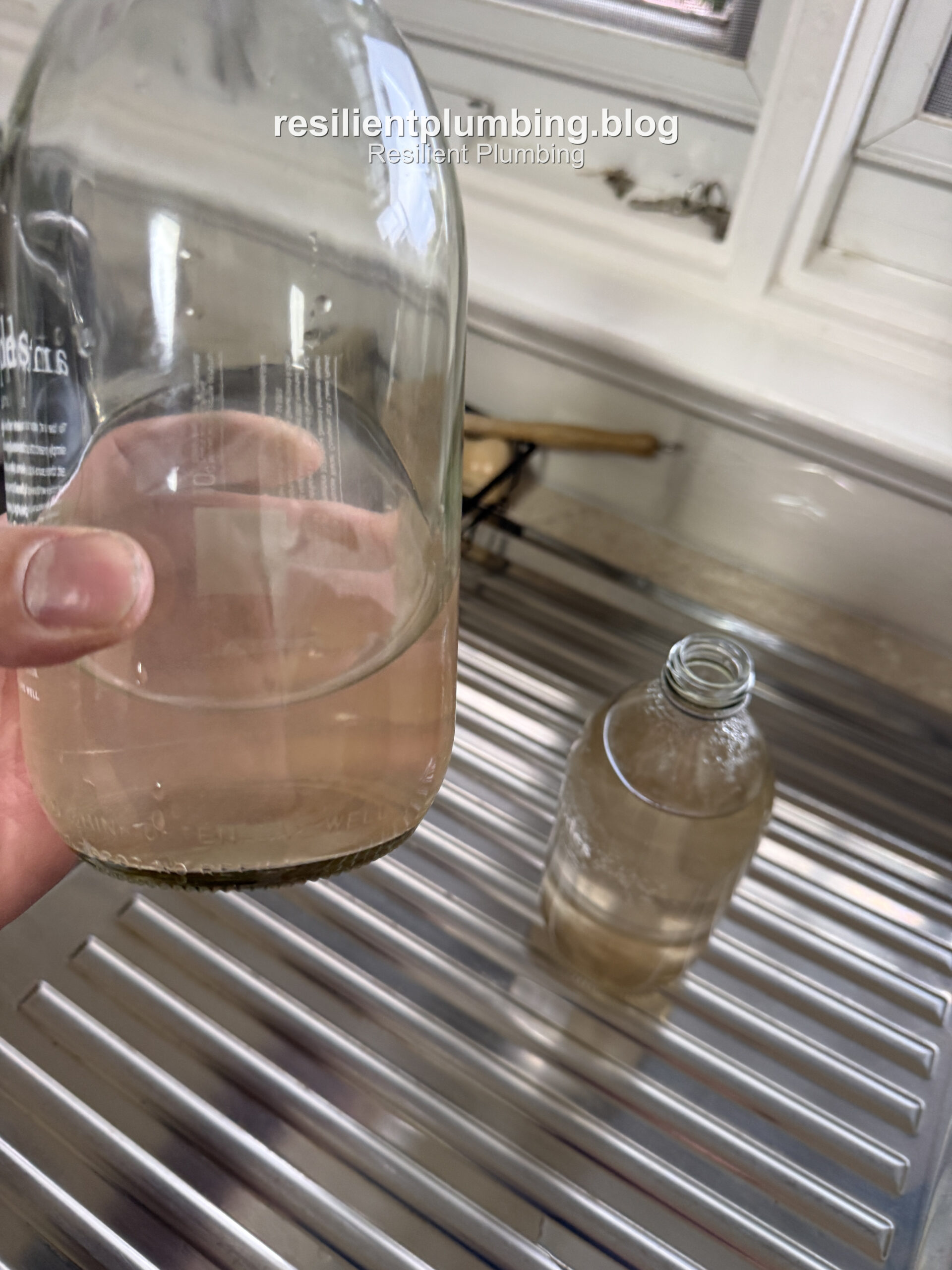 Rust-coloured hot water sample collected from a Vermont home