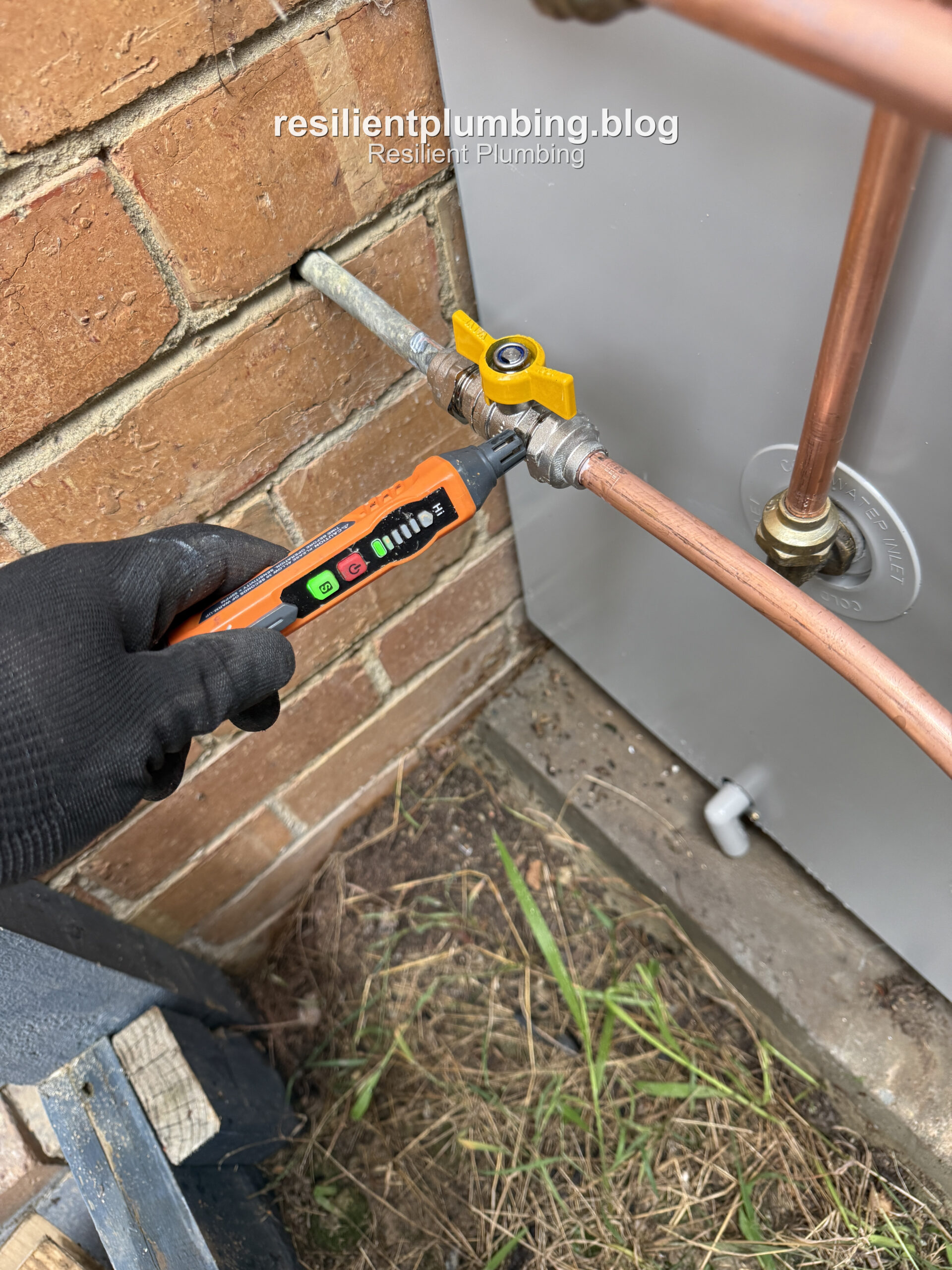 Testing a gas connection on a new hot water unit installation