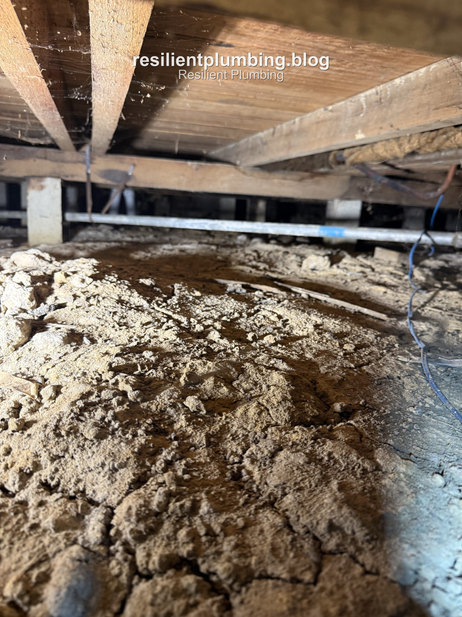 Close-up of extremely tight clearance between soil and floor joists