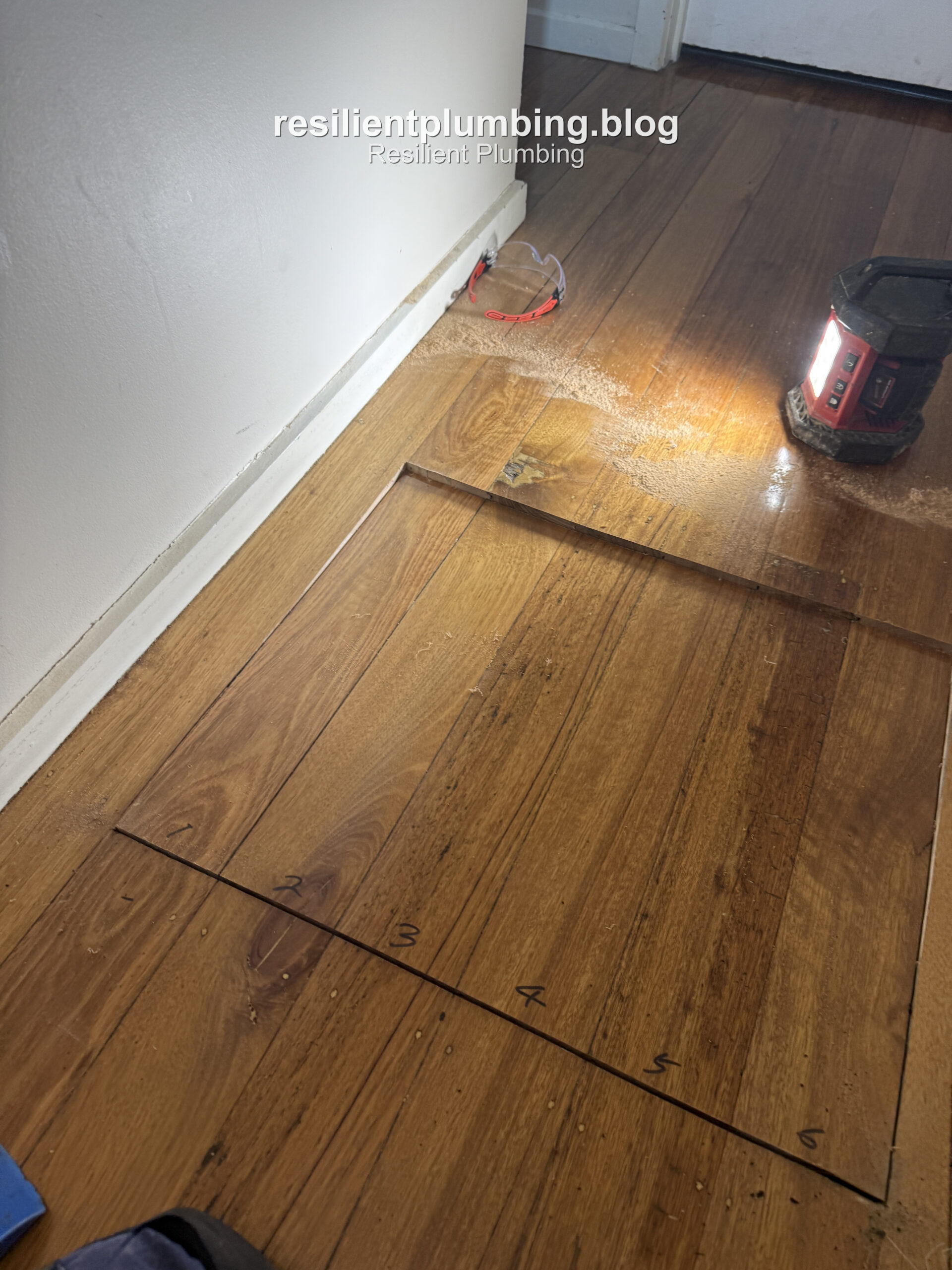 Floorboards marked with numbered cut lines ready for cutting